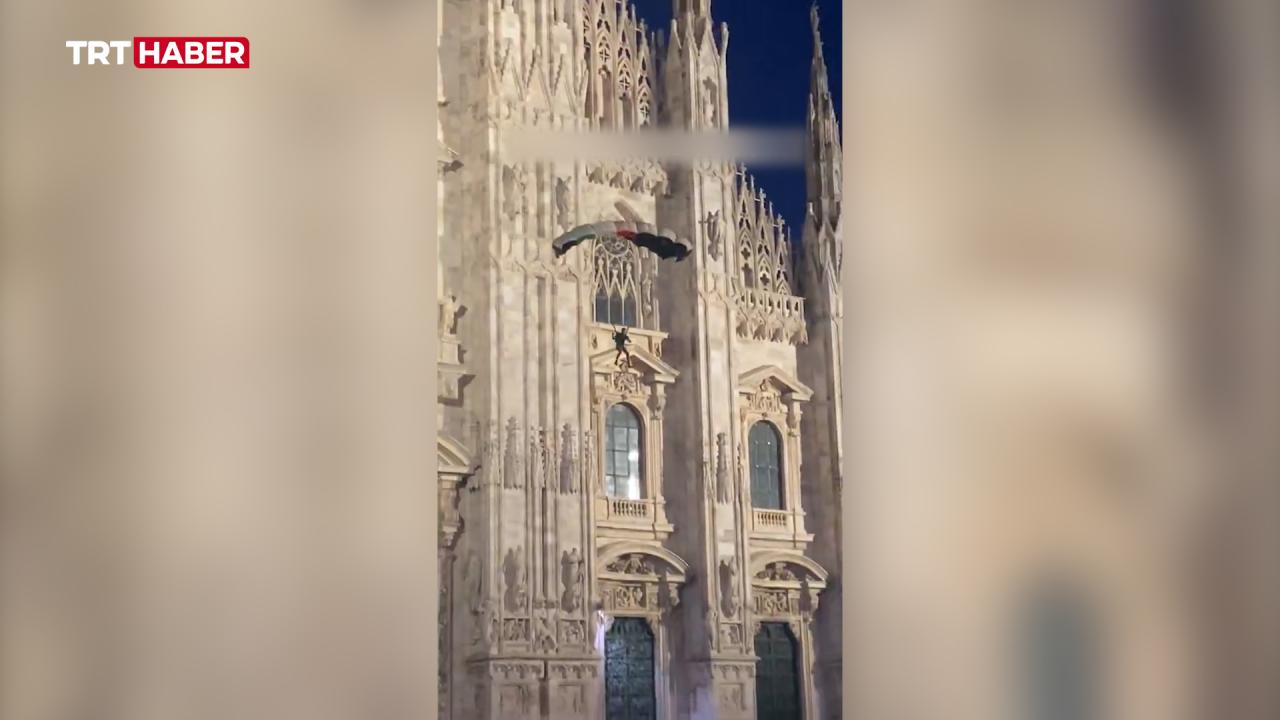 An Italian jumper descends from the Duomo Cathedral in Milan with a parachute in the colors of the Palestinian flag